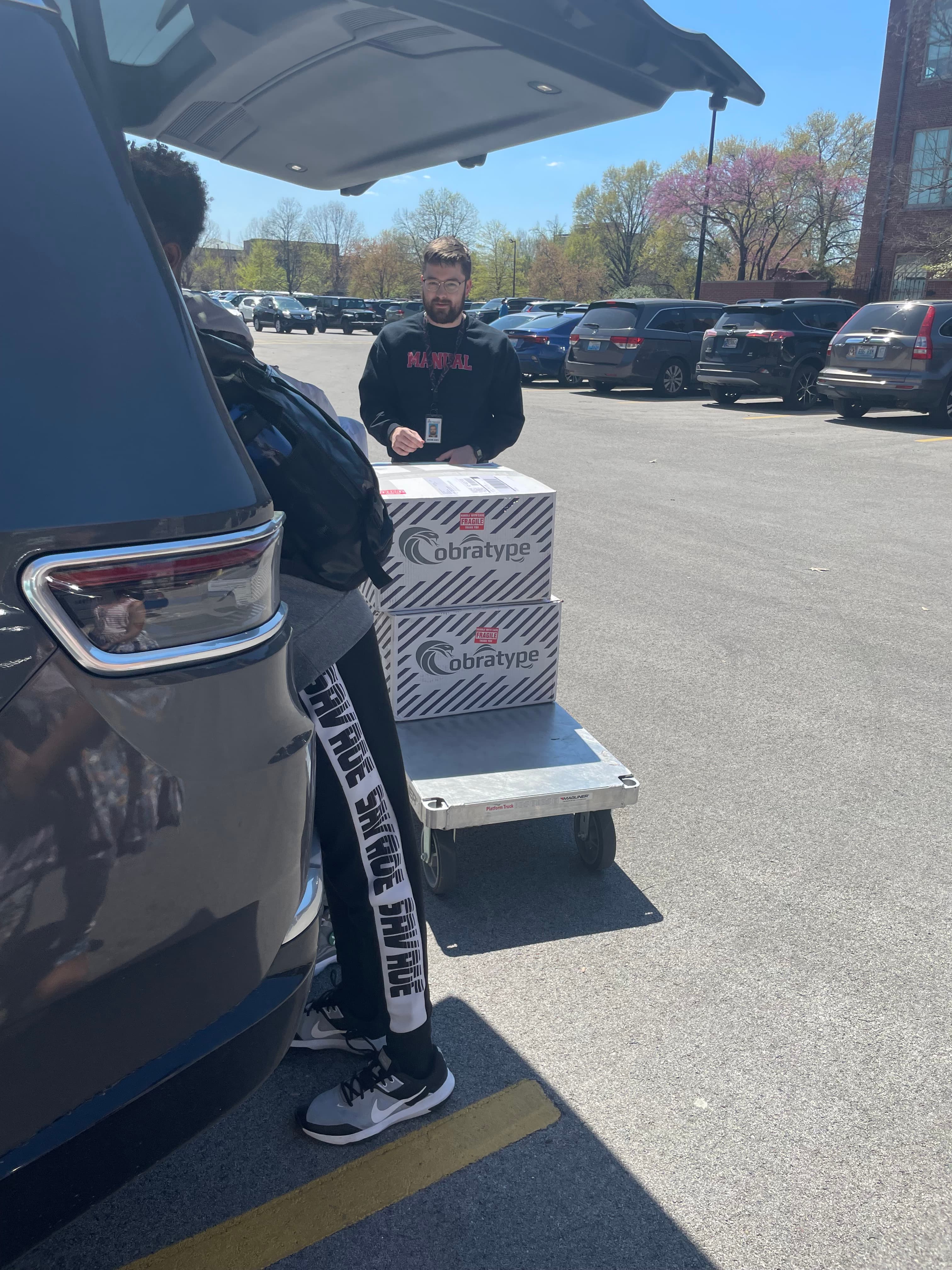 duPont Manual Esports - Unloading gaming computers from vehicle